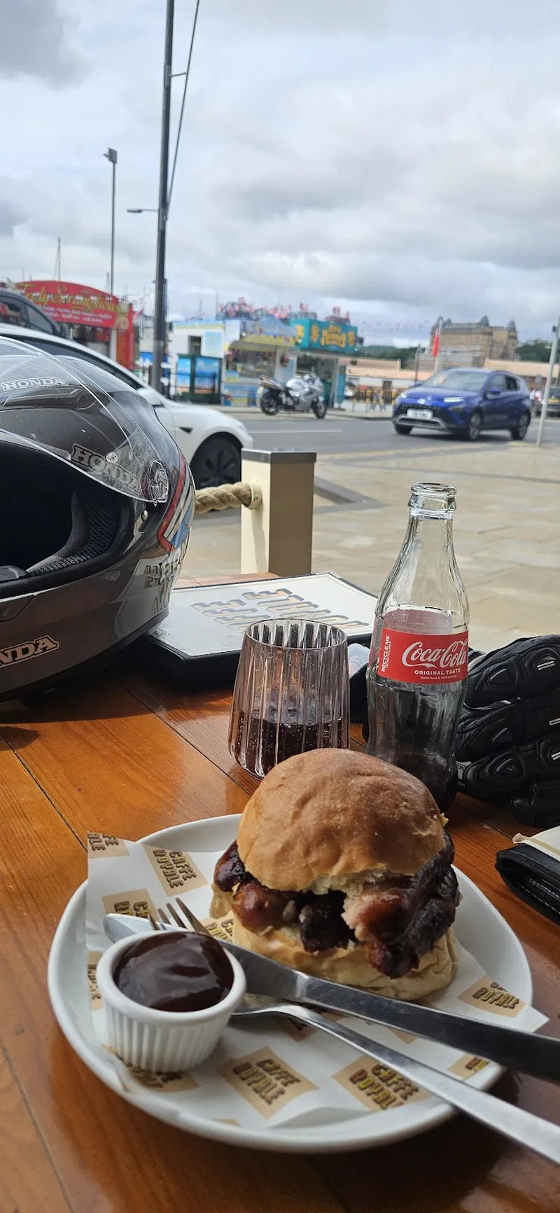 A bacon roll by the window, looking out to the seafront