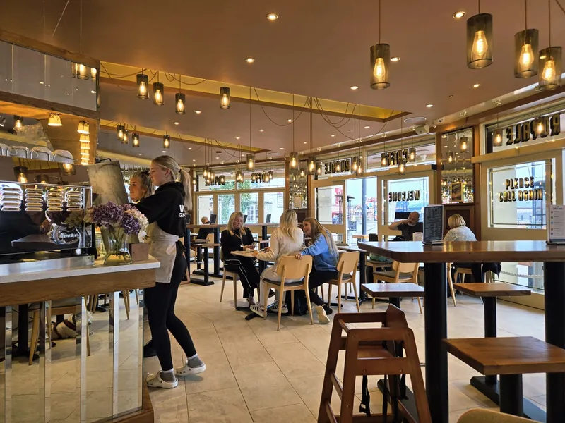 Inside Caffe Royale, the counter and window tables